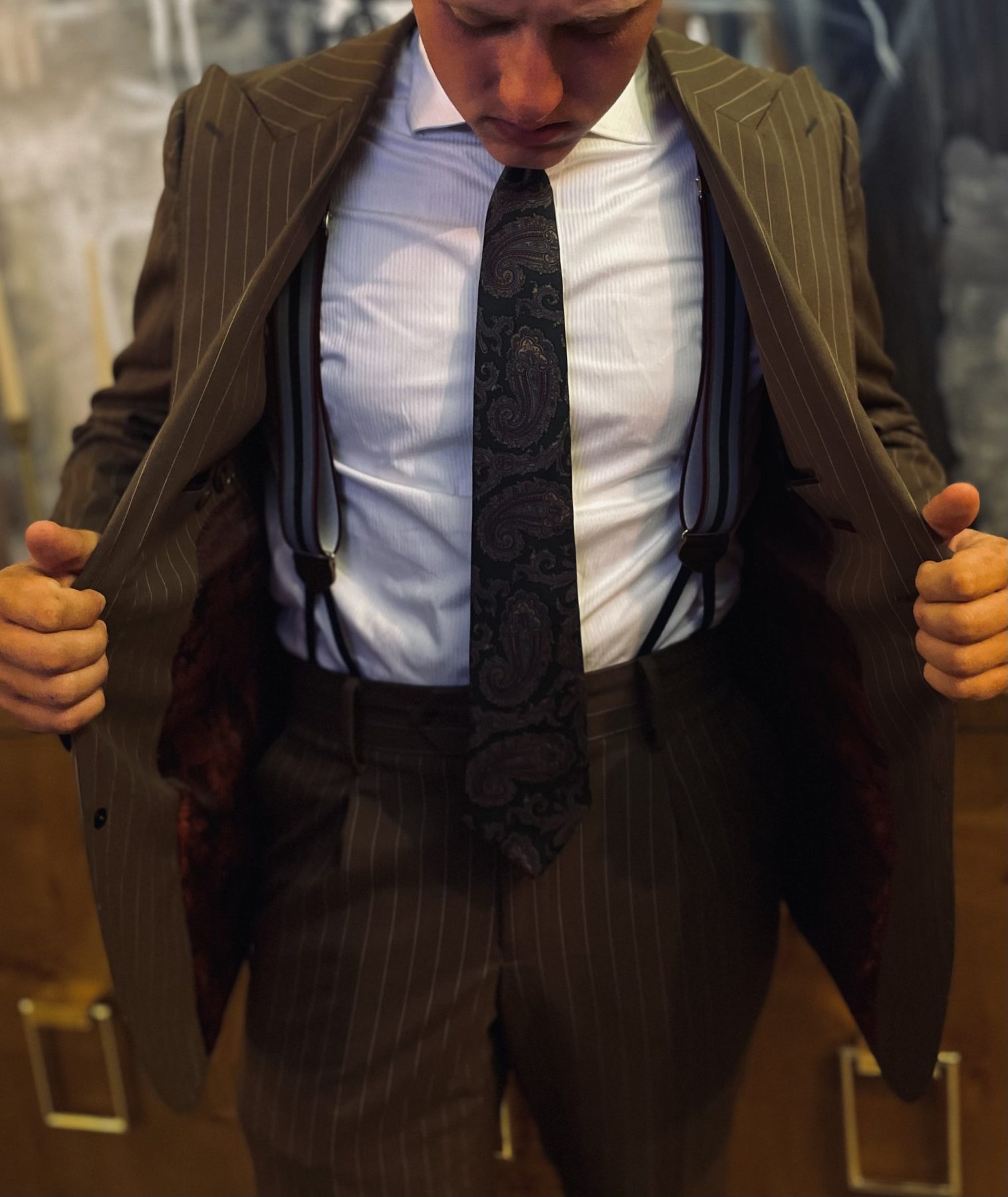 Custom suit with suspenders and tailored details