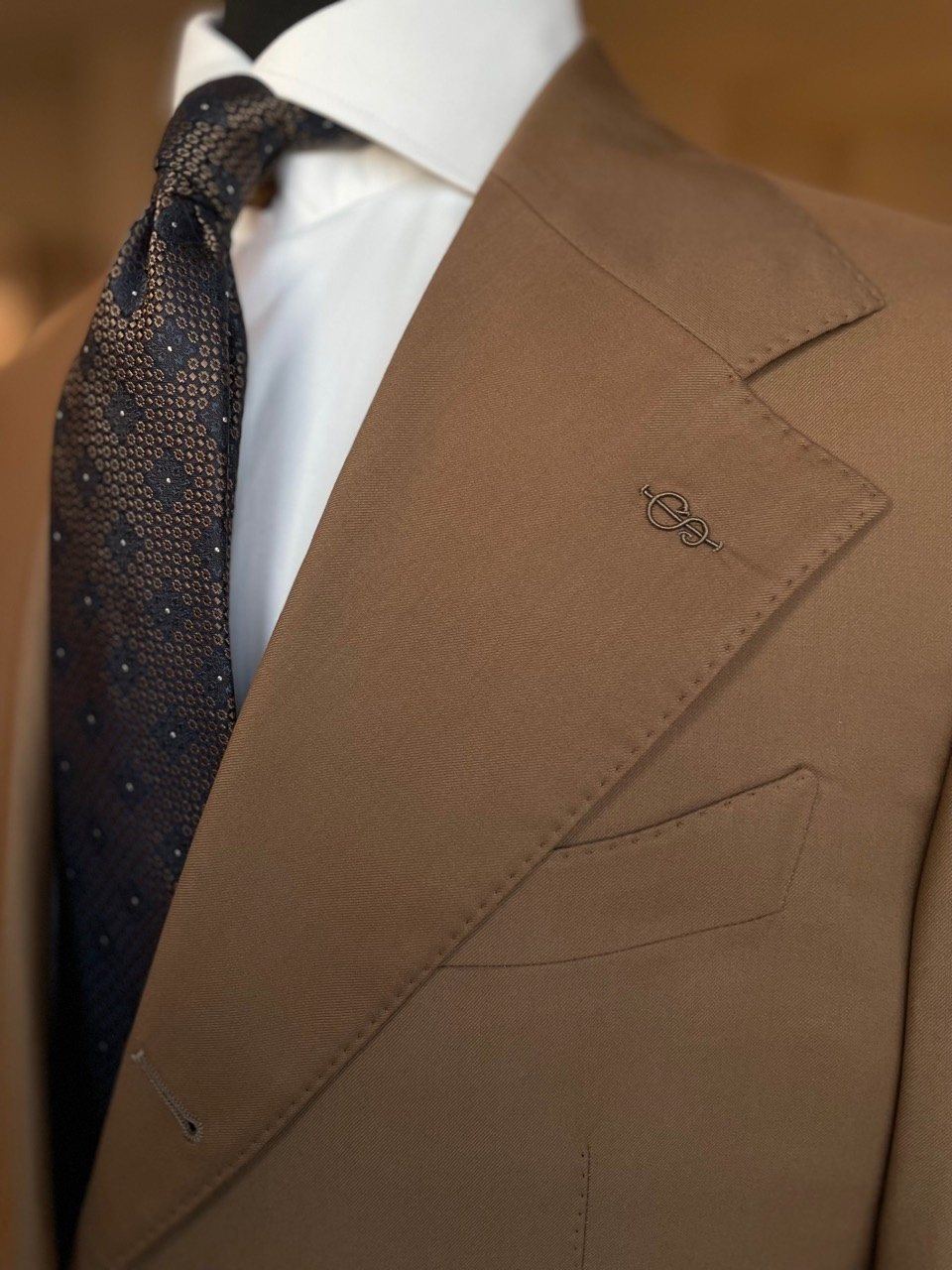 Brown custom suit lapel and tie detail