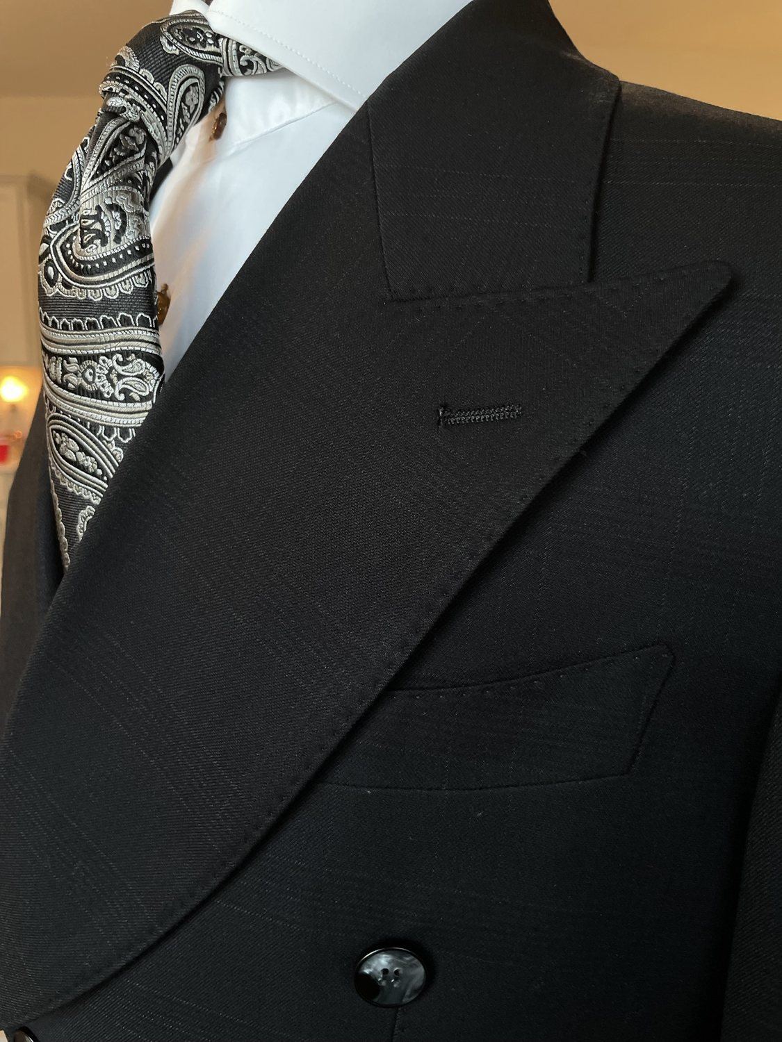 Black custom suit lapel with patterned tie