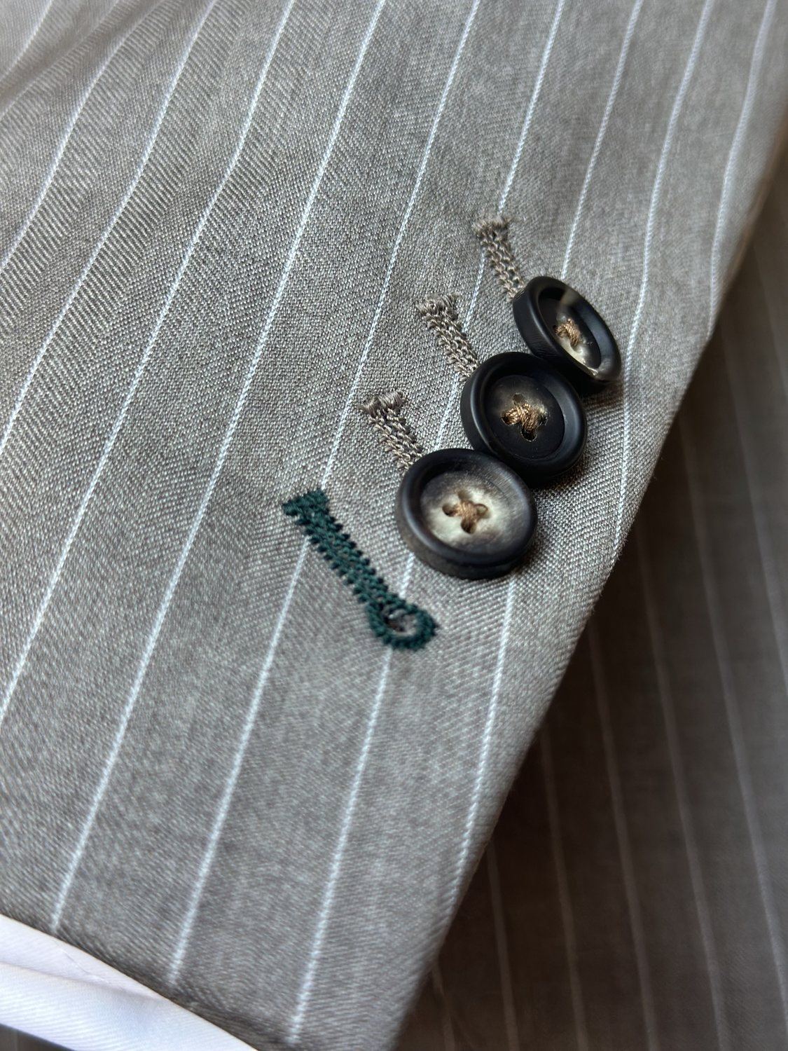 Light pinstripe sleeve button detail
