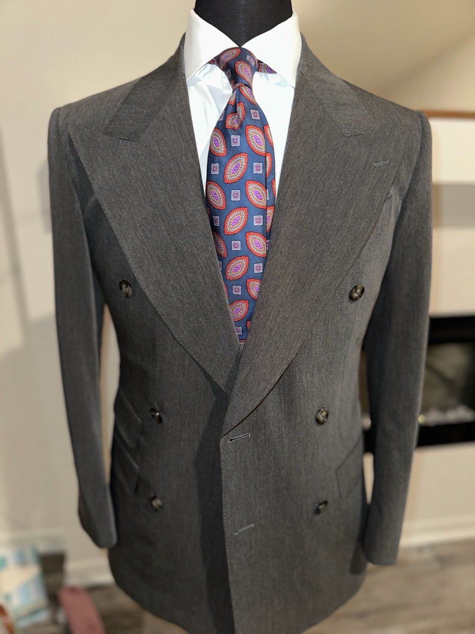 Gray double-breasted suit with patterned tie